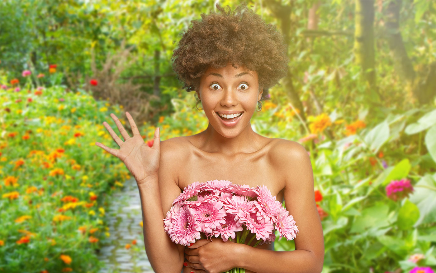 Overjoyed emotional curly haired lady holds bouquet of flowers, raises palm, covers naked body, has bugged eyes and toothy smile, well cared heathy dark skin, isolated on blue. Beauty portrait